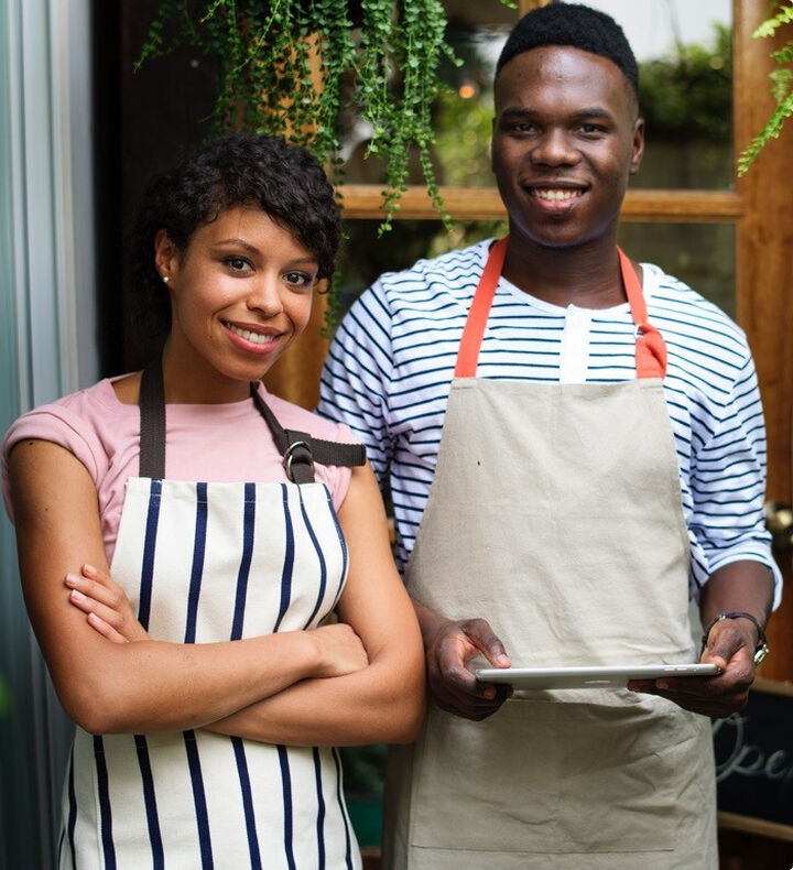 Two business owners smiling