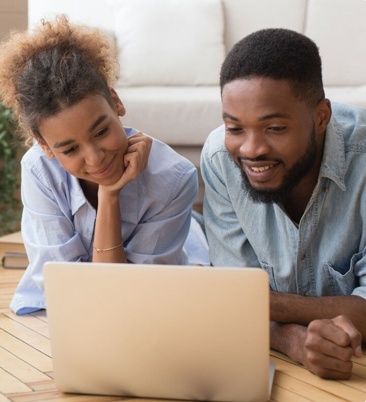 Couple using laptop